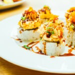 Assorted sushi featuring nigiri, sashimi, rolls, and fresh seafood, served at Banjara at Manekchowk, Ashburn, VA.